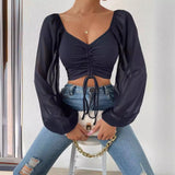 Blusa holgada con hombros descubiertos y manga ondulada para mujer