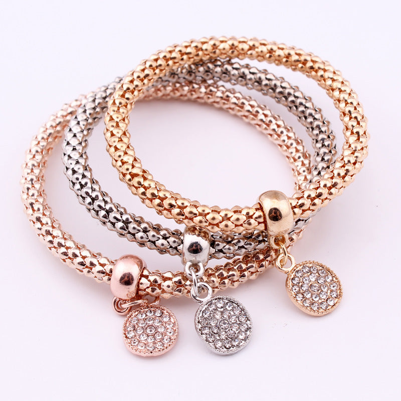 Jeweled Metal Disc Charm Bracelets