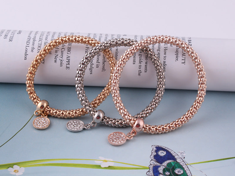 Jeweled Metal Disc Charm Bracelets