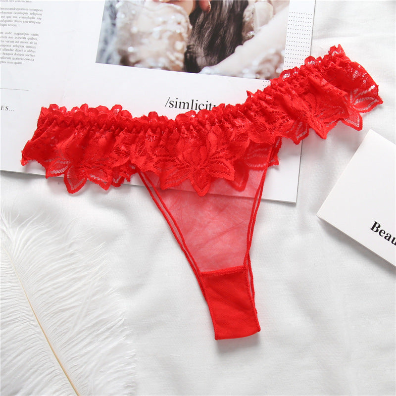 Panty de string à volants en dentelle transparente