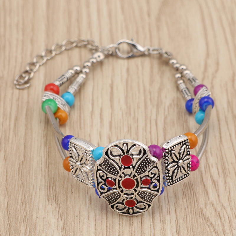 Kleurrijke metalen armband met bloemen