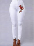 Jeans magri da ricamo floreale rosso